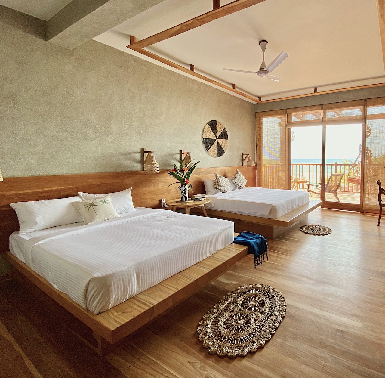 Deluxe Family Room with two king-size beds and a balcony