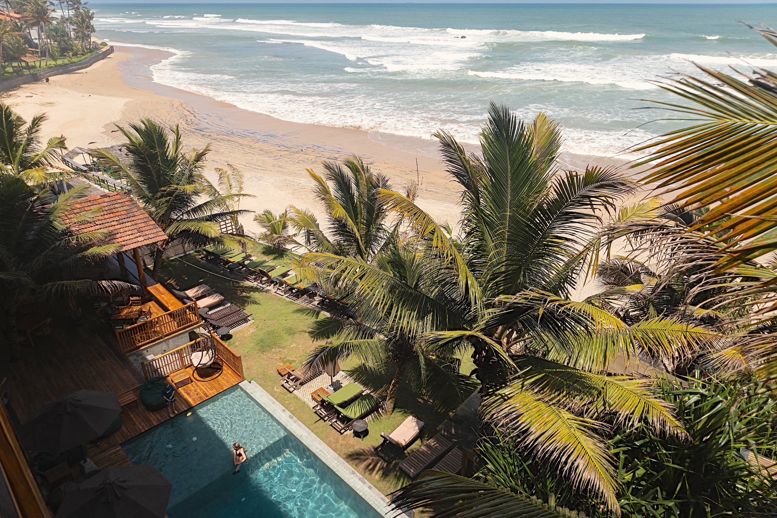 Looking down over the pool and garden of Coast 67 to Kabalana beach